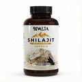 Bivalta Shilajit Kapseln in weiß-goldenem Premium-Design mit Bergmotiv. Vegane Shilajit Kapseln mit 20 % Fulvinsäure und hochdosiertem Shilajit Extrakt.